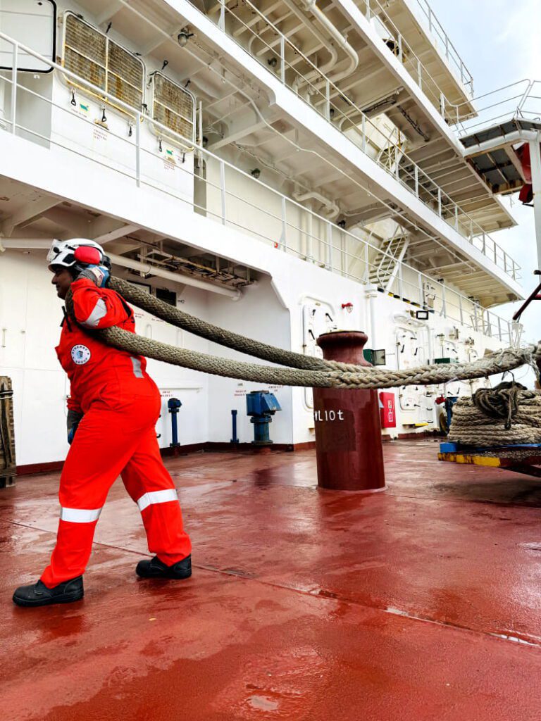 Female seafarer working on vessel