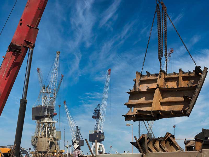 Low wide-angle view of a dismantled ship in a shipyard during green ship recycle operations